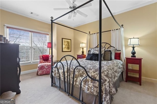 carpeted bedroom featuring visible vents, ceiling fan, ornamental molding, and baseboards