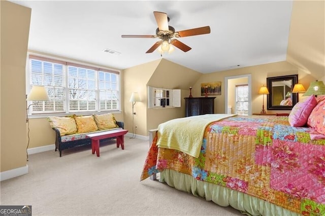 bedroom with a ceiling fan, baseboards, vaulted ceiling, and light carpet