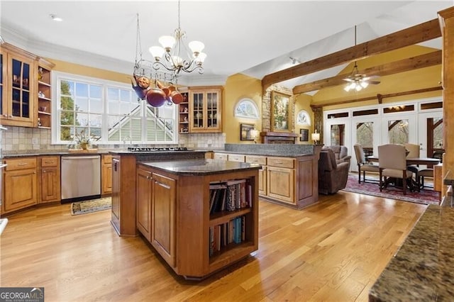 kitchen featuring a center island, open shelves, light wood finished floors, and stainless steel dishwasher