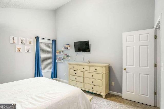 bedroom featuring light colored carpet