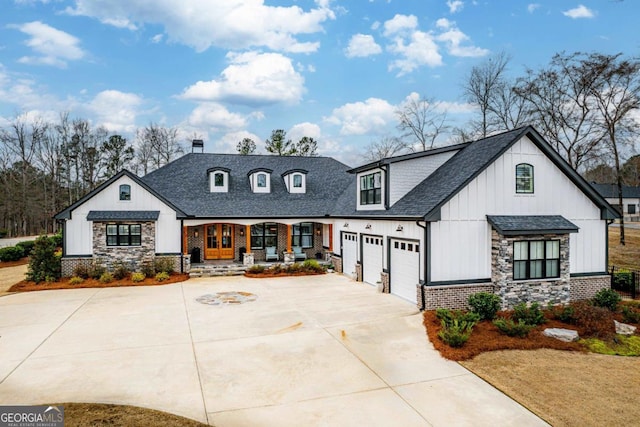 view of front of house with a garage and a porch