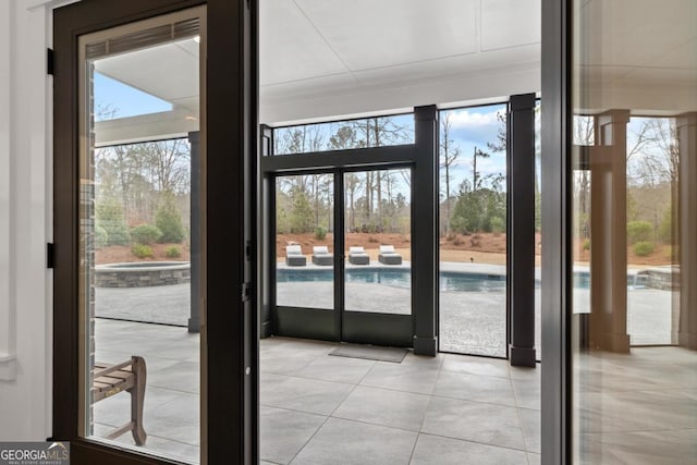 entryway with light tile patterned floors