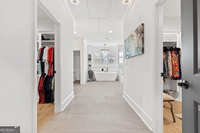 interior space featuring crown molding and an inviting chandelier