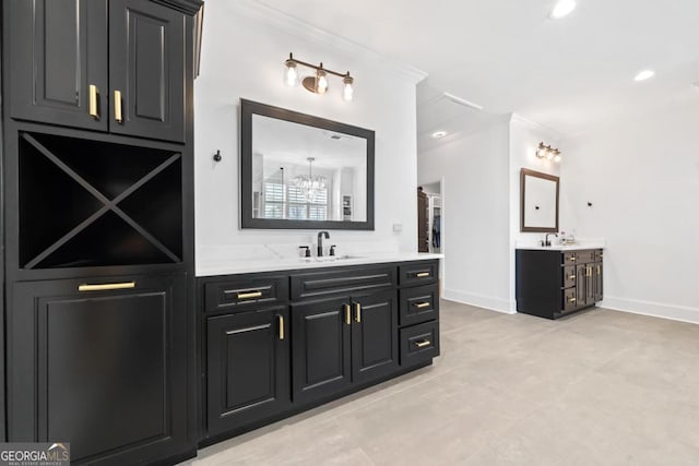 bathroom featuring ornamental molding and vanity