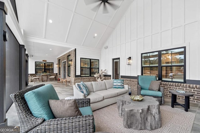 living room featuring high vaulted ceiling