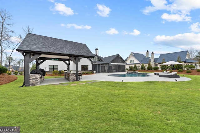 exterior space with a patio, area for grilling, a yard, a gazebo, and a sunroom