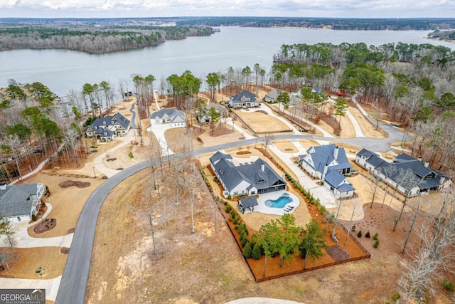 birds eye view of property featuring a water view