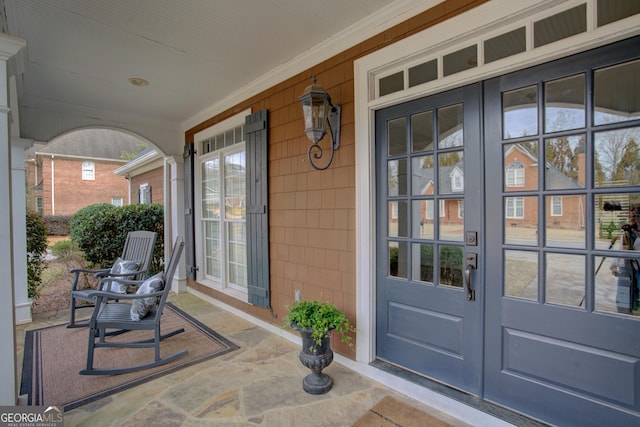 entrance to property featuring a porch