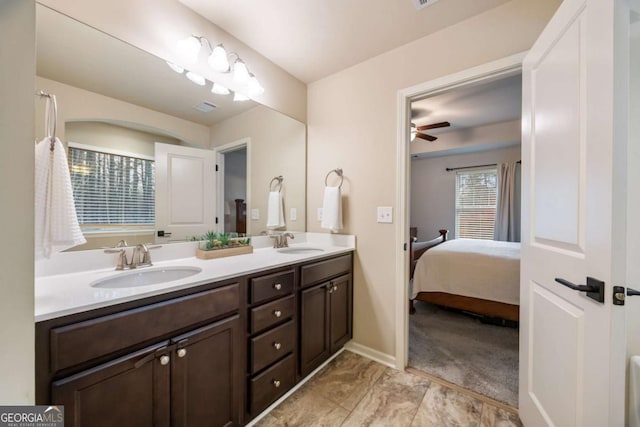 bathroom with ceiling fan and vanity