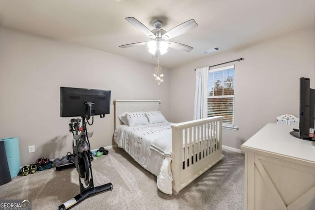 carpeted bedroom with ceiling fan