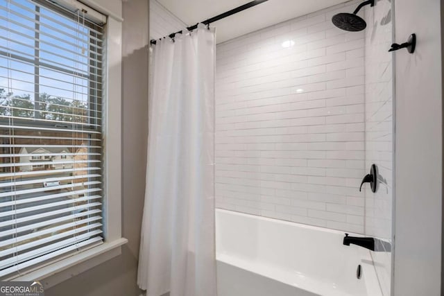 bathroom with shower / tub combo