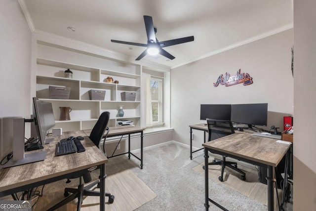 office area with crown molding, light colored carpet, and ceiling fan