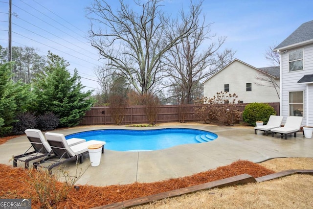 view of swimming pool with a patio area