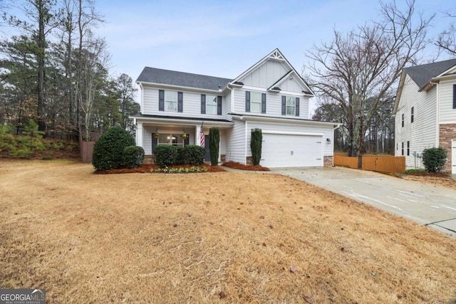 view of front of property featuring a porch, a garage, and a front yard