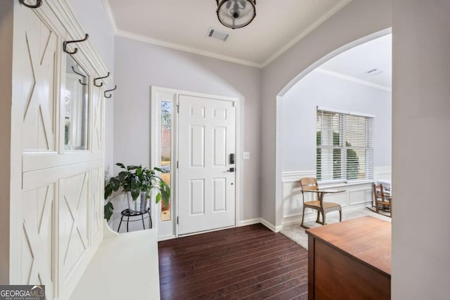 entryway featuring crown molding and dark hardwood / wood-style flooring