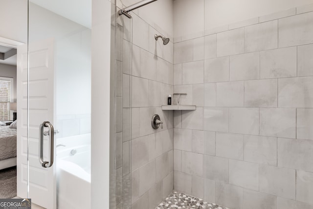 bathroom with a tile shower