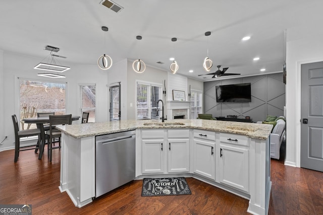 kitchen with dark wood-style flooring, a sink, visible vents, open floor plan, and dishwasher