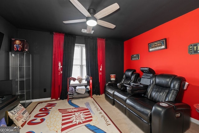 carpeted cinema with visible vents, a ceiling fan, and baseboards