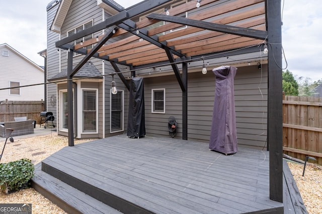 wooden deck with fence and a pergola