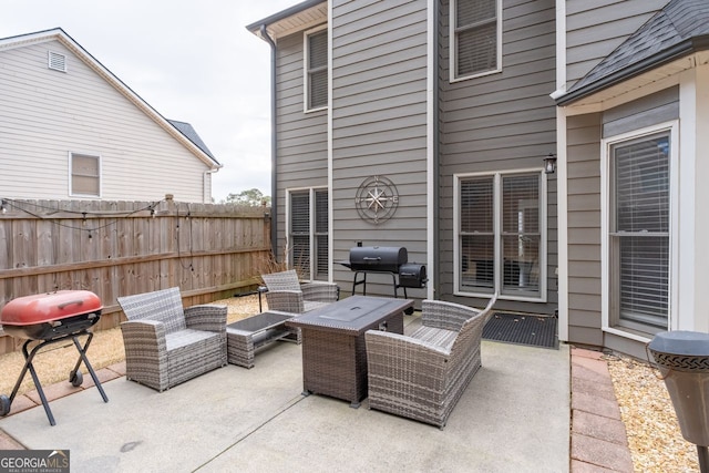 view of patio featuring a grill, an outdoor hangout area, and fence