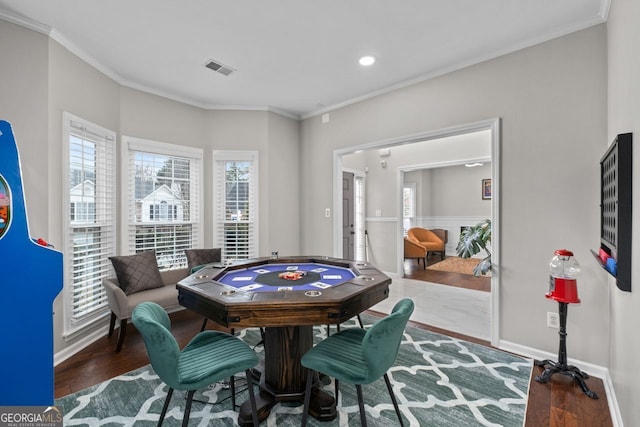 game room with visible vents, baseboards, wood finished floors, crown molding, and recessed lighting