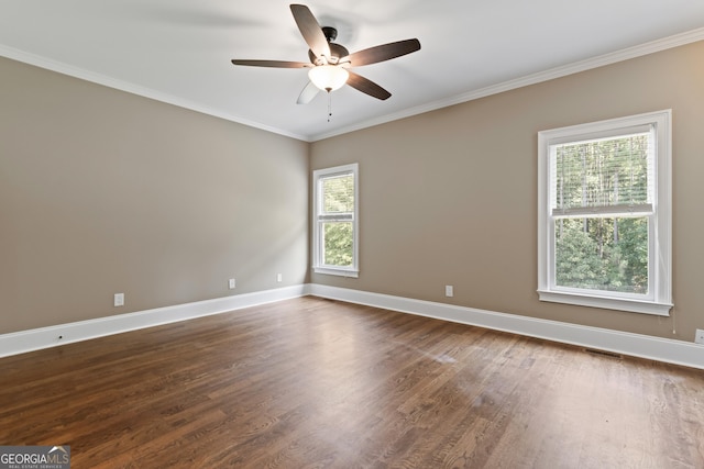 unfurnished room with ceiling fan, ornamental molding, and dark hardwood / wood-style floors