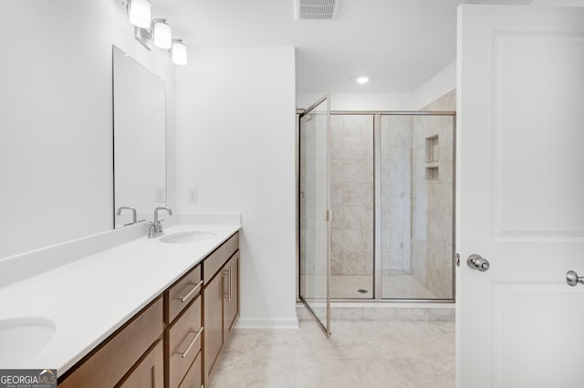 3812 Thatcher Dr SW, Marietta, GA 30008 - bathroom with a sink, double vanity, baseboards, visible vents, and a shower stall