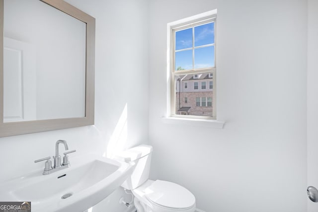3812 Thatcher Dr SW, Marietta, GA 30008 - bathroom with baseboards, a sink, and toilet