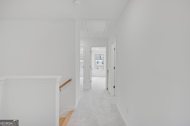 3812 Thatcher Dr SW, Marietta, GA 30008 - corridor featuring attic access, baseboards, light colored carpet, and an upstairs landing