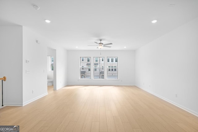 3812 Thatcher Dr SW, Marietta, GA 30008 - unfurnished living room featuring recessed lighting, light wood-type flooring, a ceiling fan, and baseboards