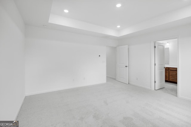 3812 Thatcher Dr SW, Marietta, GA 30008 - unfurnished bedroom featuring a tray ceiling, recessed lighting, and light colored carpet