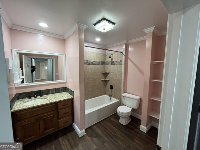 full bathroom with crown molding, wood-type flooring, toilet, and vanity