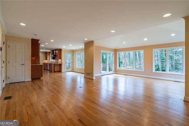 unfurnished living room with light wood-type flooring