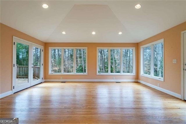 interior space featuring french doors and lofted ceiling