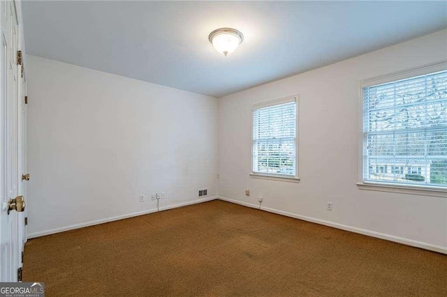 view of carpeted spare room