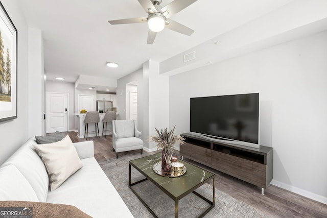 3040 Peachtree Rd NW Unit 613, Atlanta, GA 30305 - living room featuring wood finished floors, a ceiling fan, and recessed lighting