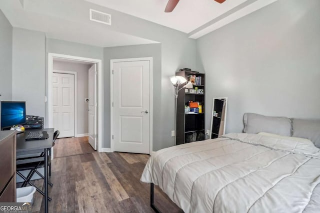 bedroom featuring ceiling fan and dark hardwood / wood-style floors