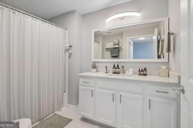 bathroom featuring vanity and a shower with shower curtain