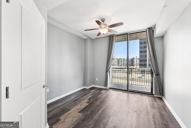 3040 Peachtree Rd NW Unit 613, Atlanta, GA 30305 - unfurnished room with dark wood finished floors and a ceiling fan