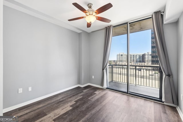 3040 Peachtree Rd NW Unit 613, Atlanta, GA 30305 - unfurnished room featuring wood finished floors, ceiling fan, floor to ceiling windows, and a view of city