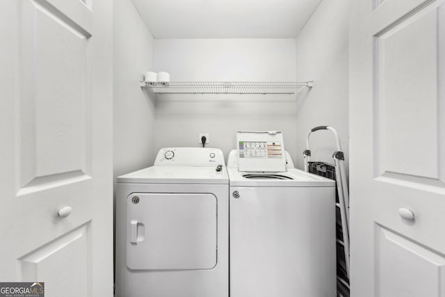 3040 Peachtree Rd NW Unit 613, Atlanta, GA 30305 - washroom with washing machine and clothes dryer