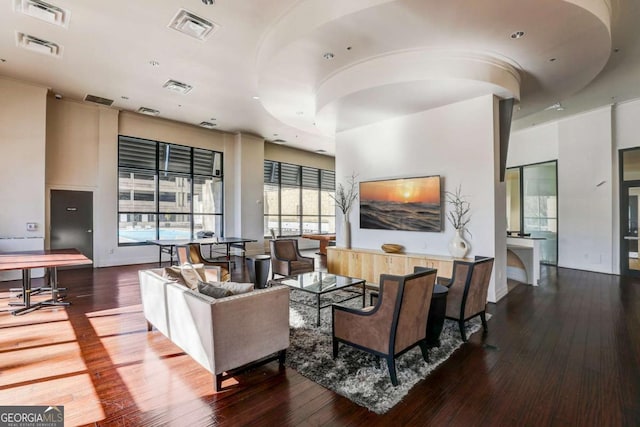 living room featuring dark hardwood / wood-style flooring