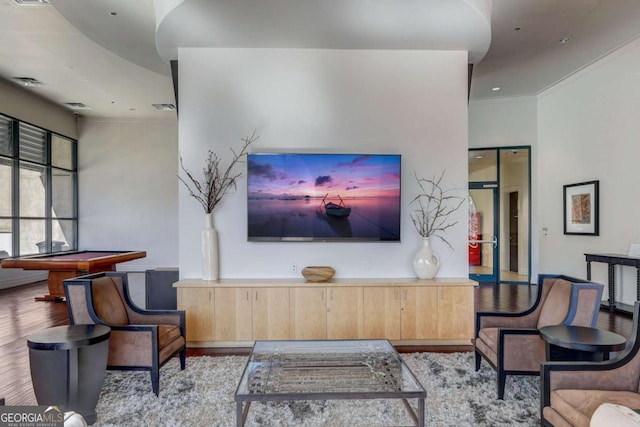 interior space with crown molding, pool table, and light wood-type flooring