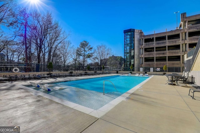 view of swimming pool featuring a patio area