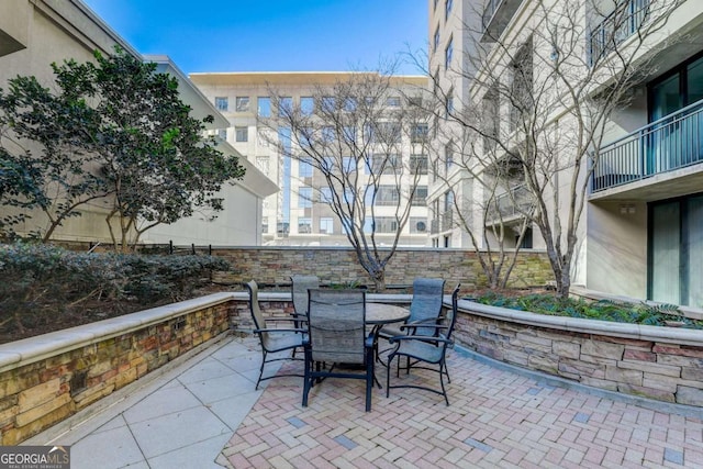 3040 Peachtree Rd NW Unit 613, Atlanta, GA 30305 - view of patio featuring outdoor dining area