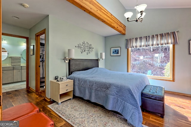 bedroom featuring a notable chandelier, wood-type flooring, connected bathroom, beamed ceiling, and baseboards