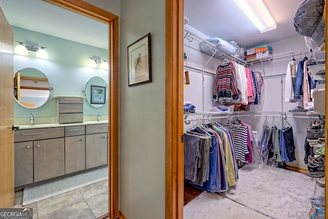 spacious closet featuring a sink