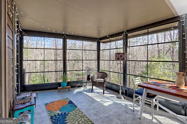 sunroom / solarium featuring plenty of natural light