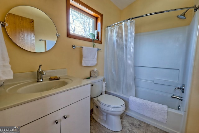 bathroom with toilet, shower / tub combo, and vanity