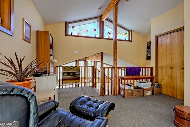 living room featuring vaulted ceiling with beams and carpet